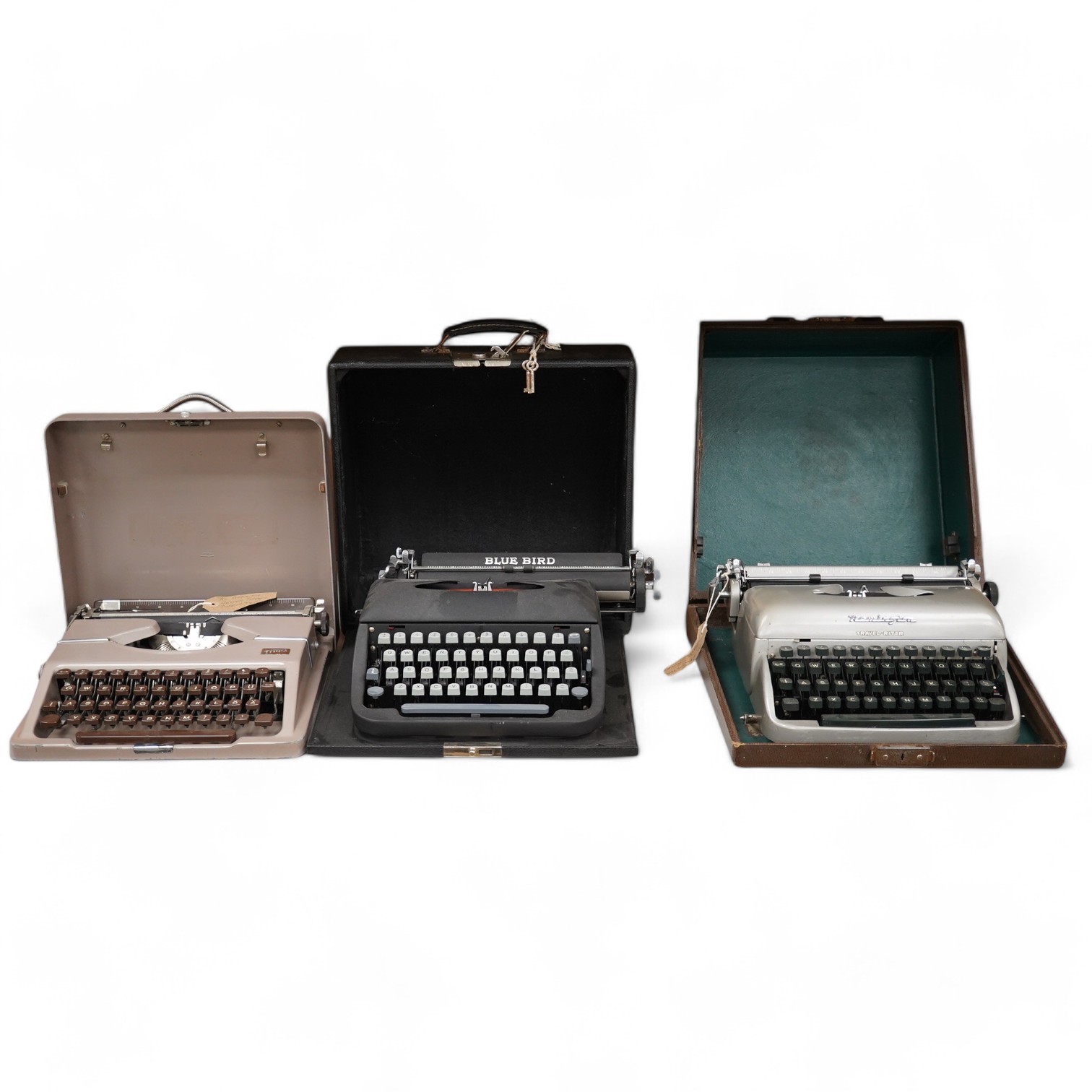 Three cased typewriters; a German Gossen Tippa, a Remington Travel-Riter and a German (U.S. Zone) Blue Bird. Condition - fair to good.